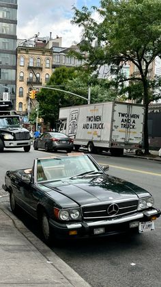 a mercedes benz parked on the side of the road