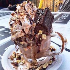 an ice cream sundae with chocolate and nuts