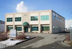 an empty building with snow on the ground