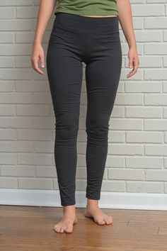 "Women's Hemp and Cotton Leggings Our hemp, cotton, spandex leggings are perfect for working out, walking, running, traveling, lounging at home, while being stylish enough to wear out. * Soft, supple & eco-luxury legging * 3 1/2\" yoga waistband * 29-30\" inseam Fabric: 52% Hemp 43% Cotton 5% Spandex Color Options: Black or Gray (Our leggings normally come plain without logo or printing. However, if you are interested in the our new yoga logo on your yoga leggings, pants, shorts, crop tops, Hemp Clothing Woman, Organic Cotton Leggings, Hemp Clothing, Casual Leggings, Athleisure Tops, Spandex Leggings, Clothing Black, Under Pants, Womens Leggings