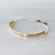 Half Cuff Bracelet, Minimalist Jewelry Bracelets for Women This dainty gold bracelet is stylish and perfect for everyday.   D E T A I L S *One gold filled bracelet *100% 14kt gold filled *3 inch gold bar hammered by hand and forged into a half cuff  *Optional extender   LENGTH  * Please select from the drop down selection. *6.5 inches with an optional extender  ∙ EXTRA LOVE ∙ Handcrafted just for you in sunny Arizona by a team of talented women. All of our jewelry comes gift packaged! We are happy to leave a note if this is a special gift, just let us know in the message box at checkout. PRODUCTION ∙ TIMES All items are made to order. Please check the estimated delivery in the shipping section for the most current production time. If you need it sooner, select a faster shipping at checkout Etsy Bracelets, Lingot D'or, Dainty Gold Bracelet, Gold Link Bracelet, Bracelet Minimalist, Snake Bracelet, Gold Bracelet For Women, Simple Bracelets, Gold Snake