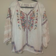 Johnny Was Blouse Sz Medium, White, Good Condition, Purchased About A Year Ago On Poshmark But Never Worn, Linen, Peasant Blouse Style, Embroidered, Absolutely Beautiful, 3/4 Sleeve. Casual White Blouse With Floral Embroidery, White Long Sleeve Blouse For Vacation, White V-neck Peasant Top With Floral Embroidery, Beach White Cotton Peasant Top, White Cotton Peasant Top For Vacation, Spring Peasant V-neck Top, White Cotton Peasant Top For Beach, White Bohemian Tops For Spring, V-neck Floral Embroidery Tops For Daywear