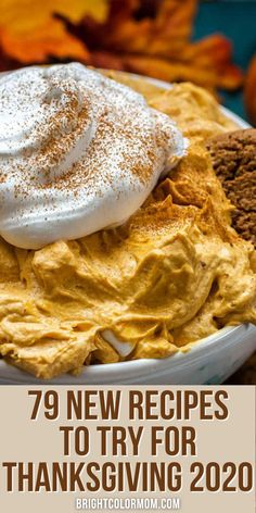 a white plate topped with whipped cream and pumpkin pie next to other thanksgiving desserts