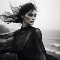 a woman with her hair blowing in the wind