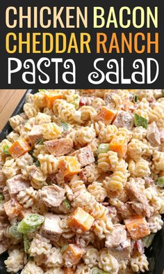 chicken bacon cheddar ranch pasta salad in a black serving dish on a wooden table