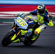 a person riding a motorcycle on a race track