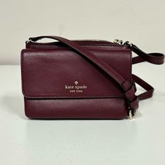 This Kate Spade Crossbody Bag Has A Textured Leather Exterior With An Adjustable Crossbody Strap. Features The Kate Spade Logo On The Front Flap Pocket. The Front Flap Has A Small Compartment And 2 Credit Card Slots. The Main Zippered Compartment Has A Slip Pocket. New Without Tags. There Is One Small Imperfection On The End Of The Strap. Approximate Size Of The Purse Is 7"(L) X 5"(H) X 1"(D). Kate Spade Crossbody Shoulder Bag With Phone Pocket, Kate Spade Crossbody Mobile Phone Bag, Kate Spade Crossbody Shoulder Bag For Mobile Phone, Elegant Kate Spade Bag With Cell Phone Pocket, Kate Spade Crossbody Bag, Kate Spade Logo, Spade Logo, Small Crossbody Bag, Small Crossbody