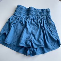 Free People Movement: The Way Home Shorts; Size Medium; Blue Color; Nwot From Website: Speed Up Or Slow Down In These Breezy, Warm-Up Style Running Shorts, Featuring A Boldly Smocked Waistband With A High-Rise Silhouette And Split Hem. Fit: Pull-On Style Shorts With A Fitted, Stretchy Waistband And Relaxed Bottom Features: High-Rise Smocked Waistband That Holds You In, Curved Hemline, Back Key Pocket Why We <3 It: The Perfect Sporty Shorts For Everything From Exercise To Daily Errands Blue Summer Shorts With Elastic Waistband, Light Blue Beach Bottoms With Built-in Shorts, Light Blue Bottoms With Built-in Shorts For Beach, Light Blue Bottoms With Built-in Shorts For Vacation, Light Blue Bottoms With Built-in Shorts And Relaxed Fit, Summer Bottoms With Elastic Waistband In Light Blue, Blue Bottoms With Built-in Shorts, Light Blue Elastic Waistband Bottoms For Summer, Light Blue Summer Bottoms With Elastic Waistband