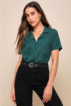 It's easy to dress for success when you have the Lulus Good Luck Charm Dark Green Short Sleeve Button-Up Top in your closet! This classic collared top has a full covered button and loop placket running the length of its breezy, woven fabric bodice. This sweet little top keeps the charm going with its boxy silhouette and front patch pocket, perfect for transitioning between casual cool and office chic! Fit: This garment fits true to size. Length: Above mid-thigh. Size medium measures 23.75" from Women’s Work Wear Summer, Casual Teaching Outfits Summer, Business Casual Collared Shirt, Business Casual Shirts Women, Summer Work Tops, Business Casual Women Outfits Summer, Outfit With Green Shirt, Social Worker Outfits For Women, Green Tops Outfit