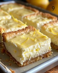 three slices of lemon pie on a white plate