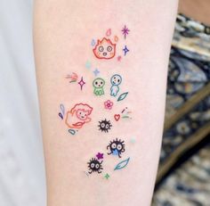 a person with a tattoo on their arm that has many different things drawn on it