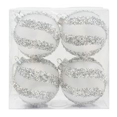 four white glass ornaments with silver glitters in a clear plastic package on a white background