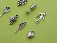 7 Different antique silver tone wine charms make up this set, ranging from 20 to 12mm. Metal Silver Metal Charms For Valentine's Day, Wine Charms, Antique Silver, Cufflinks, United Kingdom, Silver Tone, Make Up, Charms, Gems