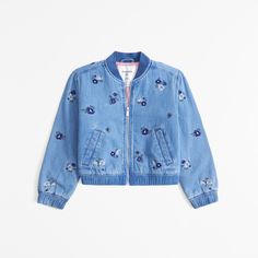 On-trend bomber jacket in a soft denim fabric, with trendy embroidered floral details, quilted interior lining, zip-up front, side pockets and banded hem and cuffs. Rompers Online, Front Tie Shirt, Abercrombie Kids, Active Leggings, Embroidered Denim, Girl Coat, Pattern Sweater, Short Pajama Set, Girls Jacket