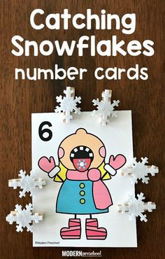 a number card with the words catching snowflakes on it and an image of a cartoon