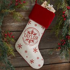 a christmas stocking hanging on a wooden wall