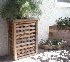 two wooden planters sitting next to each other on top of a hard wood floor