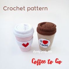 two crocheted coffee cups sitting next to each other