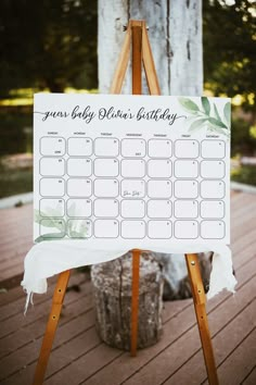 a wooden easel with a sign that says guest baby jack's birthday on it