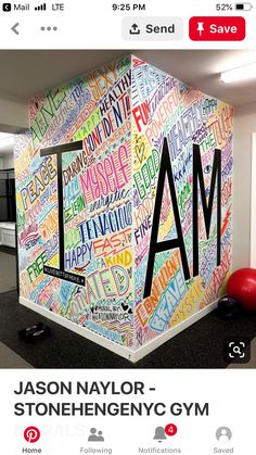 an office wall with the word iam written all over it