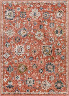 an orange and blue area rug with floral designs on the bottom, in various colors