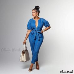 Olivia Mark - Blue Denim Jumpsuit with Stylish Design and Washed Finish Denim Blue V-neck Jumpsuits And Rompers, Chic Denim Overalls For Day Out, Chic Short Sleeve Denim Jumpsuit For Day Out, Chic Blue V-neck Denim Jumpsuit, Chic Medium Wash Denim Jumpsuit With Short Sleeves, Casual Blue Denim Jumpsuit With V-neck, Casual Blue Denim Jumpsuit V-neck, Trendy Blue Denim Jumpsuit For Day Out, Blue Denim Workwear Jumpsuit With Short Sleeves