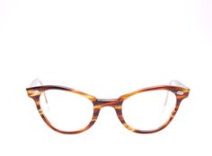 Description: 1950's/60's Brown BAUSCH & LOMB Tortoise Cat Eye Eyeglasses Frame: Brown Plastic Lenses: No Lenses, you will need to replace the lenses with your own prescription. *Easy to have your own Prescription or Sunglasses lenses installed by an Optician. Marked as 4 1/2 - 5 3/4  48  22 Measurements (Approx.) Bridge: 22mm Arms: 115mm - 145mm Lens Width: 48mm Lens Height: 33mm Frame Total Width: 135mm Condition: Very Good Vintage condition, wear is consistent with age. Please visit our sister shop for tons other great finds! https://www.etsy.com/ca/shop/BlinkOptical Please visit our sister shop for tons other great finds! https://www.etsy.com/ca/shop/PontiacDryGoods #2560 Classic Brown Acetate Cat Eye Sunglasses, Retro Tortoiseshell Cat Eye Sunglasses With Tinted Lenses, Casual Brown Cat Eye Sunglasses With Anti-reflective Coating, Vintage Brown Cat Eye Sunglasses, Tortoise Cat, Cat Eye Eyeglasses, Vintage Cat Eye Sunglasses With Anti-reflective Coating, Sunglass Lenses, Eye Wear Glasses