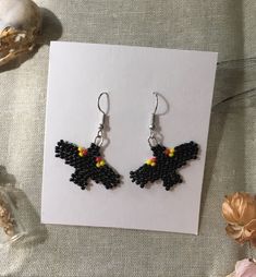 I made these beaded fringe earrings with love and positivity and these earring are shaped and coloured like little red wing black birds, which I love, and I think they are super cute. I've gotten really into beading and making beaded earrings and jewelry it's a really fun and nice progress. If any of my beaded patterns, art, and/or colour combos are sacred or too close to indigenous artists designs please don't hesitate to message me and let me know and ill happily take it down. Black Beaded Earrings With Ear Wire For Gift, Black Beaded Earrings With Round Beads As Gift, Black Beaded Dangle Earrings For Halloween, Black Dangle Beaded Earrings For Halloween, Black Beaded Earrings With Colorful Beads For Gifts, Red Wing Black Bird, Red Beaded Earrings, Bumble Bee Earrings, Beaded Patterns