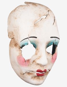 an old mask with blue eyes and red lips is shown on a white background in this image