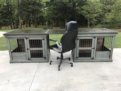 an office chair sitting in front of a dog kennel with its doors open on the ground