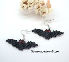 "Stylish earrings for Halloween, Seed bead bat earrings These bat earrings for Halloween are specially made for you to emphasize your style for the holiday. They emphasize your style and help you stand out from everyone else. This earrings is made from the high-quality Czech bead, with the use of sterling silver furnice, with a bright bat pattern. This bat earrings can carry every girls and woman of any age, harmonizes with any clothes. Earrings details: Length: Dangle earrings measure 1.2\" fro Bat Seed Bead Earrings, Black Beaded Dangle Earrings For Halloween, Black Dangle Beaded Earrings For Halloween, Halloween Seed Bead, Beaded Bat, Gothic Items, Halloween Beaded Jewelry, Earrings Handmade Beaded, Etsy Artwork