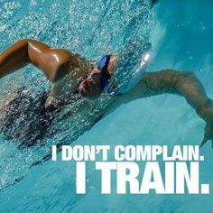 a man swimming in a pool with the words i don't complain, i train