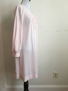 "Nightgown Pink Vintage Floweral 1960's 70's Gaymode Pennys . . Arm to Arm 20.5\" across, Bottom of gown 31\" across. Total Length 34\" across. Ribbon on front of gown held on with a pin and two hole by pin see photo #9 2\" seam is out on right shoulder. See photo 10. FREE SHIPPING On Orders Over $35 To view our jewelry/accessories offerings visit our sister site here on Etsy: JewelryStoreFinds Pet free - smoke-free - perfume free shop. Every shipment is carefully, tastefully and discreetly pack Retro Pink Sleepwear For Spring, Vintage Fitted Sleepwear For Sleepover, Fitted Vintage Sleepwear For Sleepover, Vintage Long Sleeve Nightgown For Pajama Party, Vintage Pink Sleep Dresses, Vintage Pink Long Sleeve Sleepwear, Pink Vintage Sleep Dress, Vintage Dresses For Pajama Party, Spring Retro Nightgown For Sleep