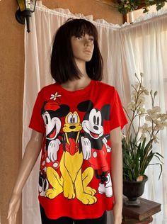 Bright red T-shirt, DISNEY characters UNISEX T-shirt. Filling the entire front, Mickey, Minnie and their dog Pluto in between. Scoop neck, short sleeves. Its a poly/rayon blend but feels like cotton. The tag says XL, but actual measurements are : Bust : 40" Sleeves :8" Length : 25" Santa Fe Nm, Red T Shirt, Mickey Minnie, Red Shorts, Red Tshirt, Vintage Store, Vintage Disney, Vintage Jewellery, True Vintage