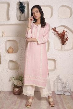 Blush pink linen kurta with lace trims and hand embroidered motifs. Comes with white palazzo pants.
Component: 2
Pattern: Embroidery
Type Of Work: Lace and Thread
Neckline: Notch
Sleeve Type: Three Quarter
Fabric: Linen
Color: Pink
Other Details: 
Palazzo with lace trims
Side slits
Note: Can be customised to any color as per the customers requirement. Please contact the customer service for further details
Note: This style is made from pure fabrics and the embroidery is very intricate
Occasion: White Palazzo Pants, Kurta And Palazzo, Kurta Palazzo Set, Purple Linen, Linen Embroidery, Embroidered Motifs, Palazzo Set, Lace Bands, Linen Color