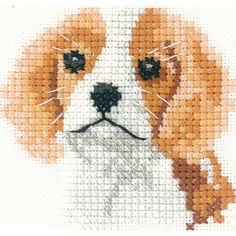 a cross - stitch pattern of a dog's face