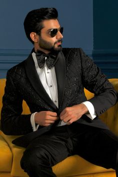 Black tuxedo embellished with bead wavy patterns and welt pockets. Comes with pleated shirt, trouser and bowtie. - Aza Fashions Fitted Tuxedo Sets For Parties, Elegant Party Sets With Suit Collar, Luxury Embellished Formal Sets, Luxury Embellished Party Suit, Glamorous Formal Sets For Party Season, Glamorous Formal Party Sets, Tailored Tuxedo Party Sets, Embellished Tuxedo Suit For Party, Embellished Tuxedo Blazer For Evening