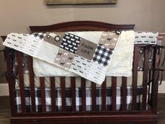 a baby crib with a blanket on top of it