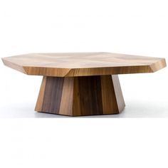 a wooden table that is made out of wood and has an unusual shaped design on the top