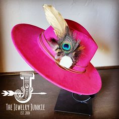 If you’re looking for the perfect accessory to complement your favorite boho style, look no further. This Boho-Style Western Felt Hat w/ Natural Feather & Turquoise Hat Accent by The Jewelry Junkie is absolutely everything that you need. Not only is it easy to incorporate into any and all outfits, but the genuine leather and natural feathers of the band immediately elevate whatever it is you’re wearing. One Size Hat with adjustable inner hat liner (see last photos) The same primary feathers will Pink Bohemian Fedora Hat, Adjustable Pink Bohemian Fedora, Pink Bohemian Wide Brim Fedora, Bohemian Pink Hat Band For Kentucky Derby, Bohemian Pink Fedora With Flat Brim, Pink Bohemian Fedora With Flat Brim, Bohemian Pink Wide Brim Fedora, Bohemian Pink Felt Hat With Short Brim, Handmade Bohemian Pink Fedora