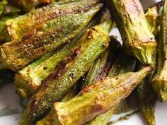 grilled green vegetables on a white plate