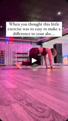 a woman doing push ups on the floor in front of a tv screen with an ad that reads, when you thought this life exercise was to easy to make a reference to your abs