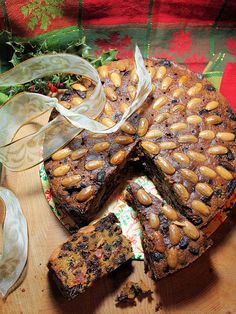 a cake with nuts on it sitting on a table