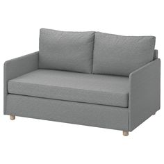 a gray couch with two pillows on it's back and one arm facing the camera