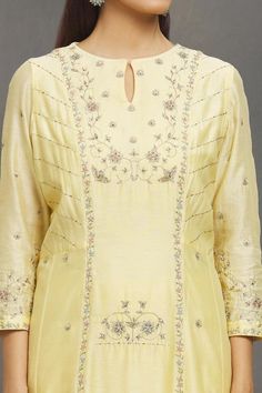 Pastel yellow kurta with aari, zardozi, sequin emboidery in floral pattern. Paired with flared pant and border embroidered dupatta. 
Components: 3
Pattern: Embroidery
Type Of Work: Aari, zardozi, sequin, thread
Neckline: Keyhole
Sleeve Type: Long sleeves
Fabric: Kurta and Dupatta: Chanderi, Pant: Chanderi, Organza
Color: Yellow
Other Details: 
Sheer panel on pant hem
Occasion: Sangeet - Aza Fashions Transitional Straight Kurta Palazzo Set With Intricate Embroidery, Slub Silk Palazzo Set With Resham Embroidery, Art Silk Palazzo Set With Intricate Embroidery, Chanderi Palazzo Set With Resham Embroidery And Long Sleeves, Long Sleeve Raw Silk Palazzo Set With Zari Work, Long Sleeve Palazzo Set With Intricate Embroidery For Festivals, Eid Long Sleeve Slub Silk Palazzo Set, Chikankari Embroidery Long Sleeve Slub Silk Sets, Slub Silk Long Sleeve Palazzo Set With Resham Embroidery