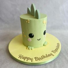 a birthday cake that is shaped to look like a cupcake with an animal on top