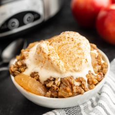 an apple crisp with ice cream in a bowl