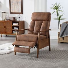 a brown recliner chair sitting on top of a rug