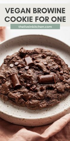 vegan brownie cookie for one on a white plate with text overlay that reads, vegan brownie cookie for one