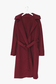 Wrap coat in 100% super soft, mid weight, drapy high grade wool with no lining features an elegant wrap shape and oversized fit, dual front slant pockets and tonal belt to finish. Size & Fit - US Size: XS-2 / S-4 / M-6 / L-8 / XL-10 - EUR Size: XS-34 / S-36 / M-38 / L-40 / XL-42 - Length: 40.2" / 102cm - Bust: 41.7" / 106cm - Measurements taken from size small Content & Care - 100% Wool - Unlined - Dry clean only - Imported Burgundy Coat, Genuine People, Red Wool Coat, Wool Wrap Coat, Office Wardrobe, Wool Wrap, Wrap Coat, Red Coat, Woolen Coat